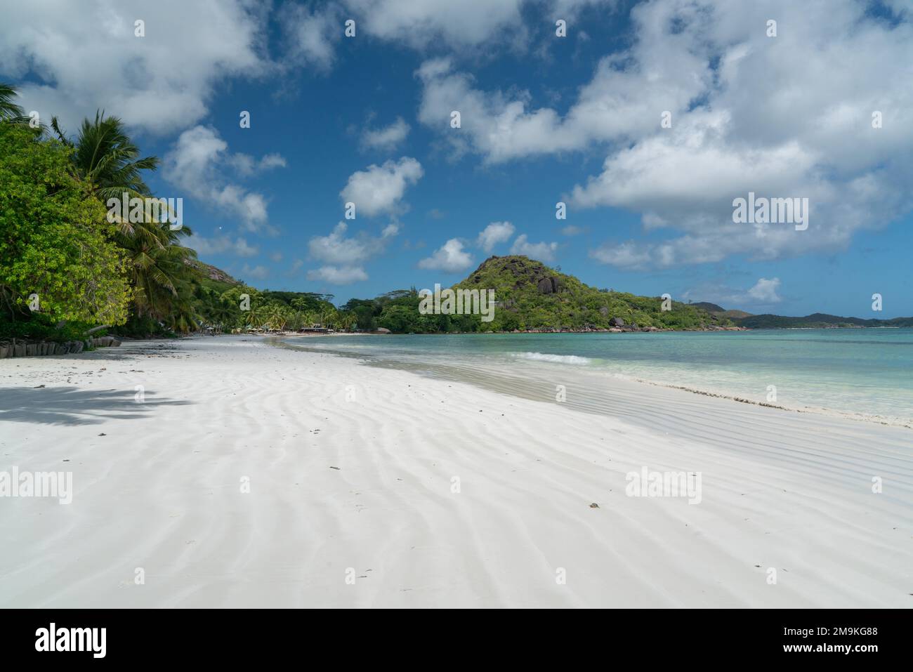 View along the long beach of Anse Volbert on the Seychelles. Stock Photo
