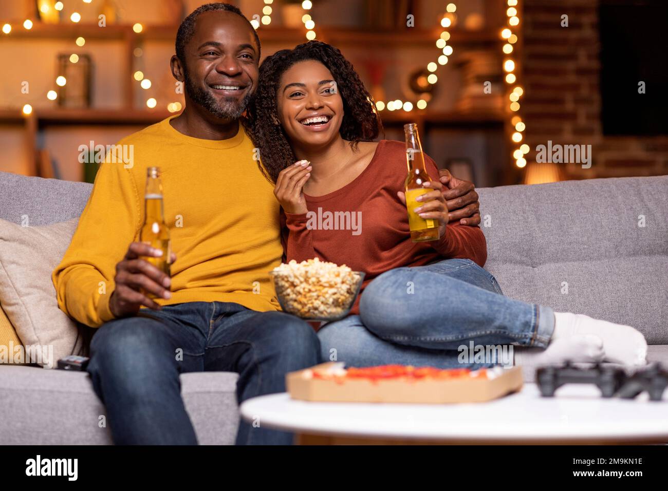 Happy black couple spending winter holidays together at home Stock Photo