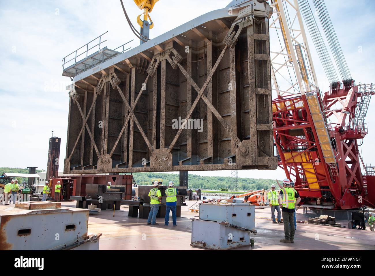 The Quad Cities Heavy Lift Crane meticulously lowers the miter gate