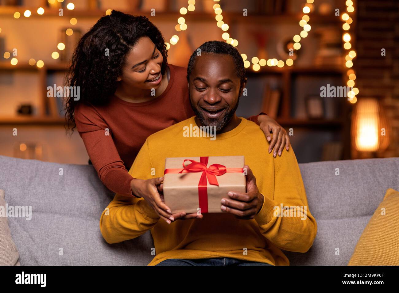 Pretty black woman greeting her beloved husband with anniversary Stock Photo