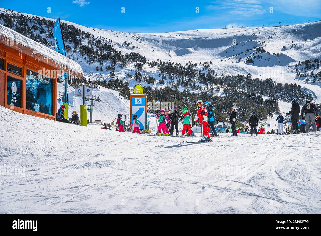El Tarter, Andorra, Jan 2020 Ski instructors with a group of young kids at assembly point. Winter holidays in Pyrenees Mountains Stock Photo