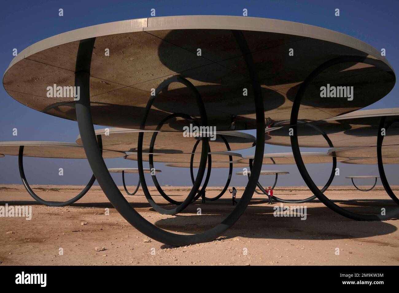 People take pictures at the Olafur Eliasson's Circular Mirror ...