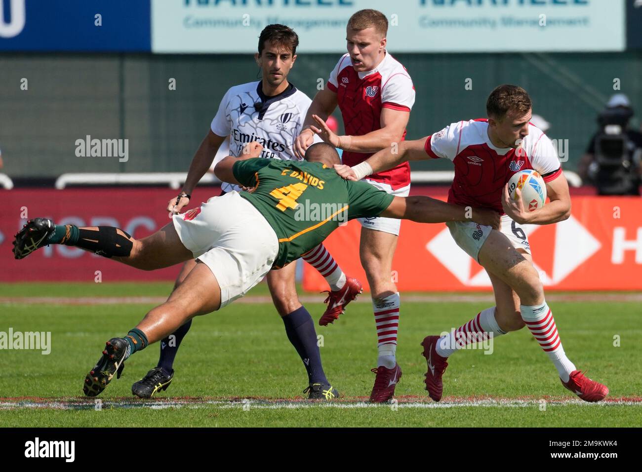 Great Britain's Paddy Kelly, is tackled by South Africa's Zain Davids ...