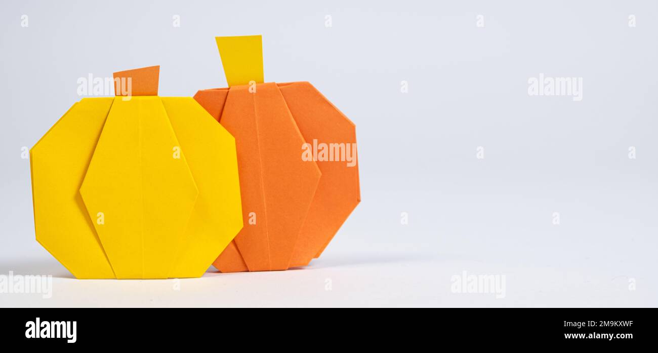 Halloween DIY Origami - Yellow and Orange Paper Pumpkins on a White Background Stock Photo - Alamy