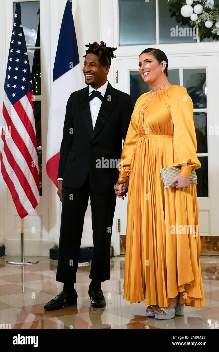 Musician Jon Batiste arrives with his wife Suleika Jaouad for the State Dinner with President Joe Biden and French President Emmanuel Macron at the White House in Washington, Thursday, Dec. 1, 2022. (AP Photo/Susan Walsh) Stock Photo