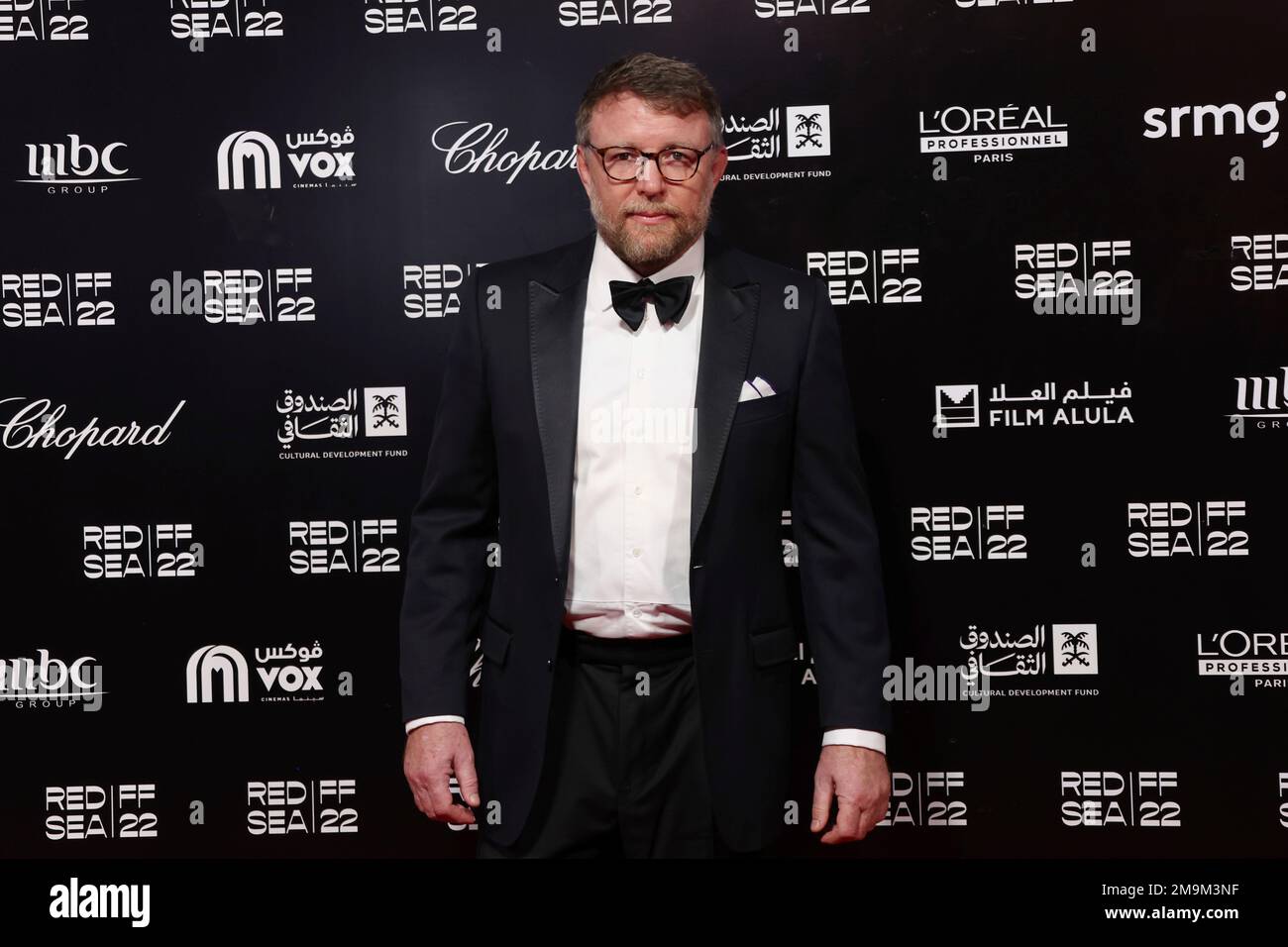 Guy Ritchie poses for photographers upon arrival at the opening gala ...