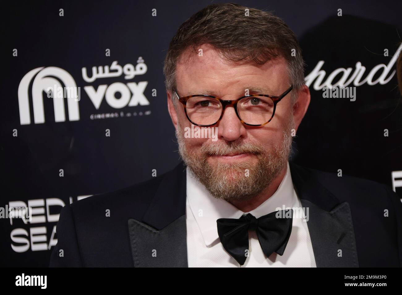 Guy Ritchie poses for photographers upon arrival at the opening gala ...