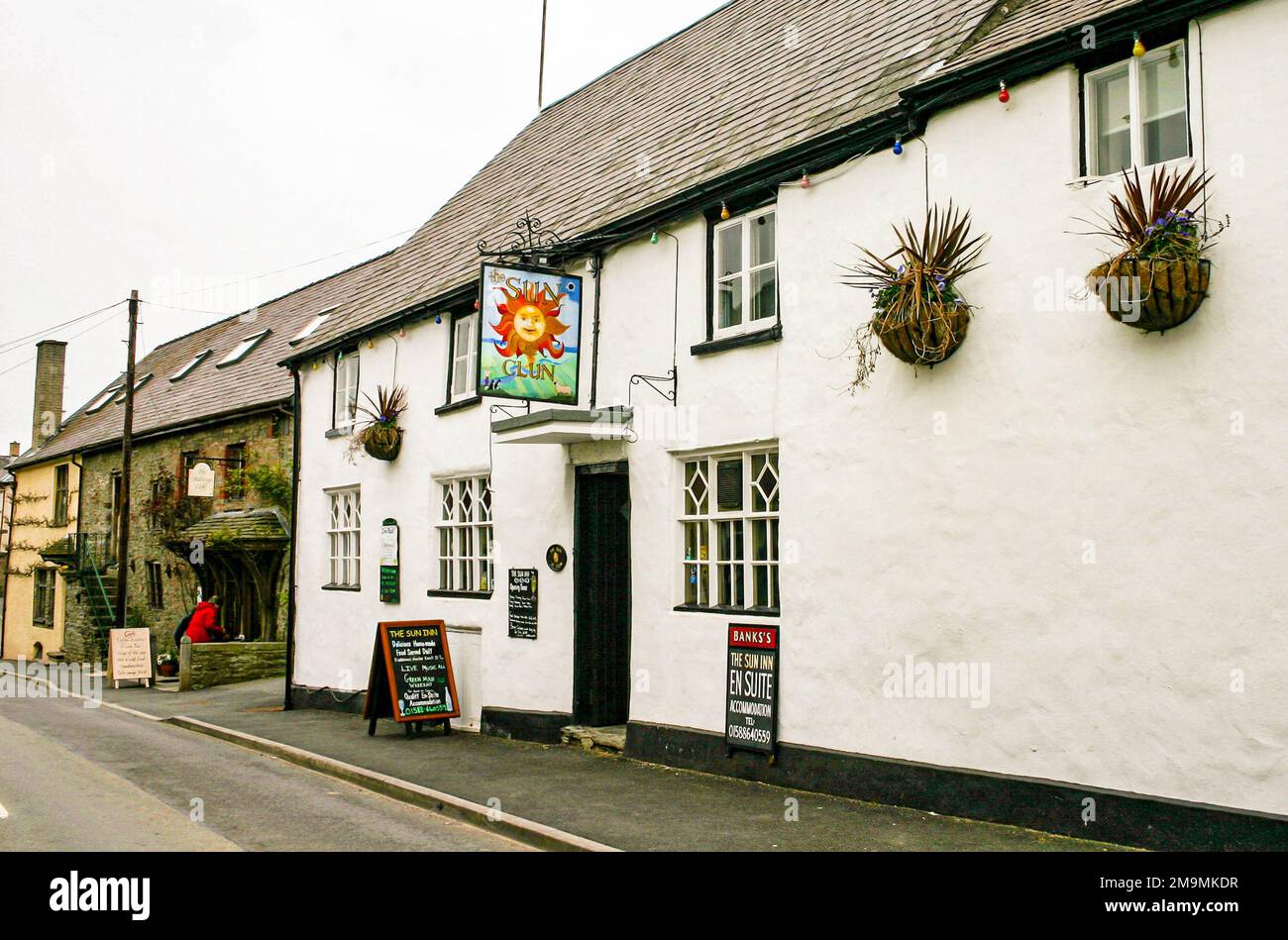 The Sun Inn and pub, Clun, Shropshire, England is a 15th Century building with traditional cruck construction, a grade two listed building. Stock Photo
