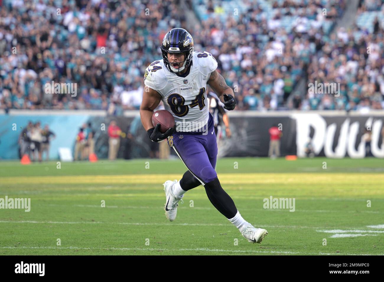 Baltimore Ravens tight end Josh Oliver (84) runs in for a 12-yard touchdown  on a pass play during the second half of an NFL football game against the Jacksonville  Jaguars, Sunday, Nov.