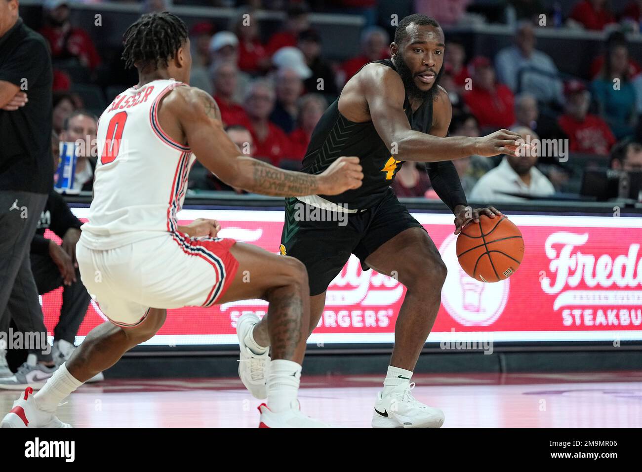 Norfolk State guard Joe Bryant Jr. (4), right, tries to drive past