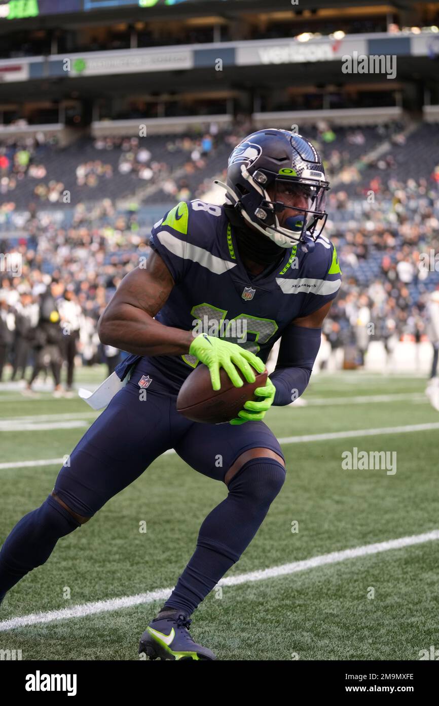 Seattle Seahawks wide receiver Laquon Treadwell (18) carries the ball  before an NFL football game against the Las Vegas Raiders, Sunday, Nov. 27,  2022, in Seattle, WA. The Raiders defeated the Seahawks