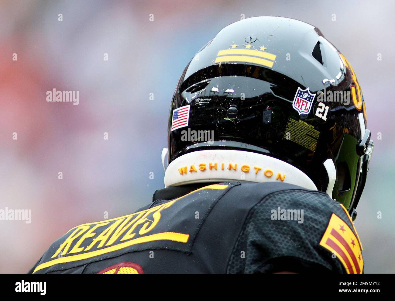 Washington Commanders safety Jeremy Reaves (39) dons a helmet with a