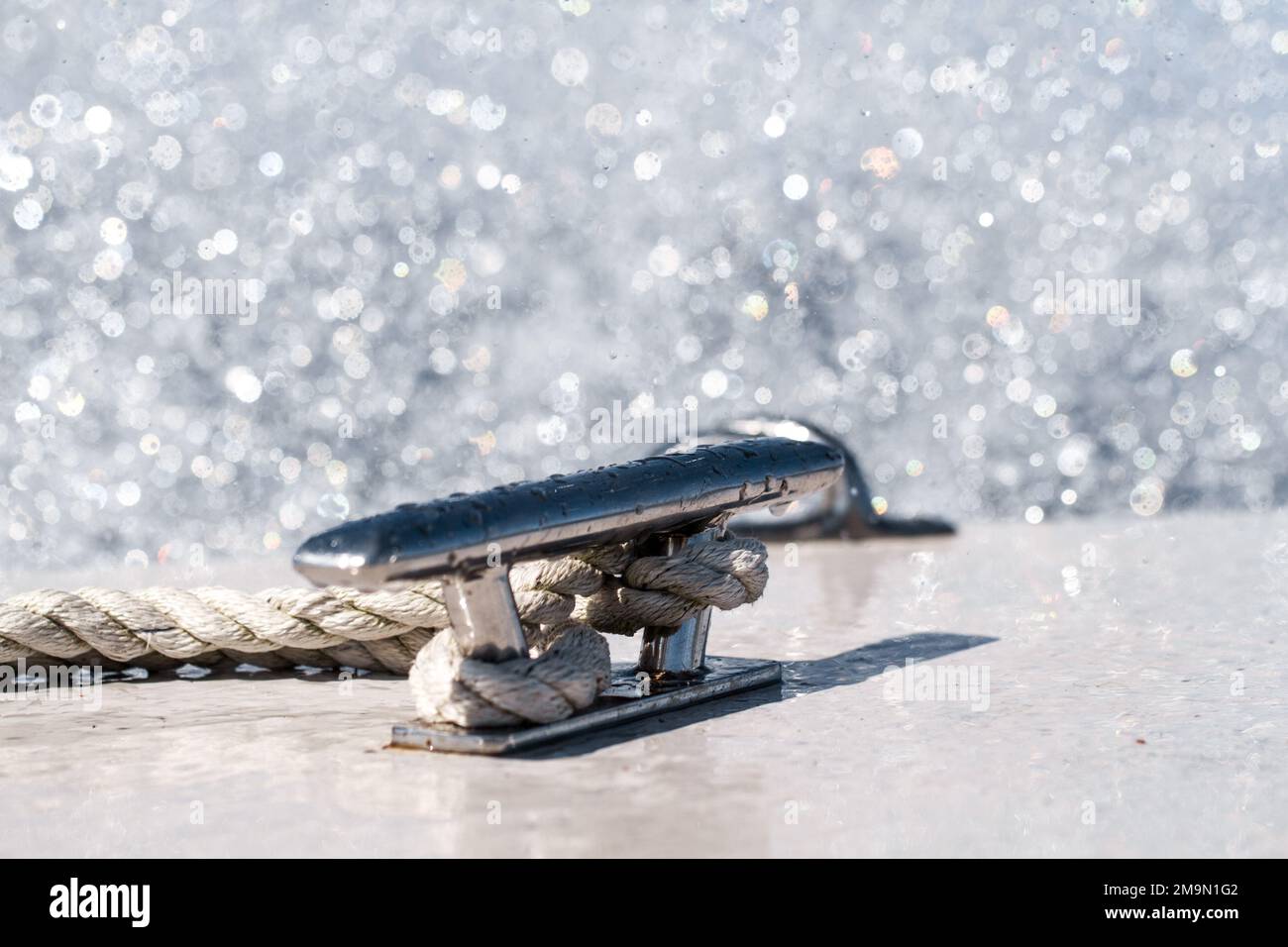 Ocean spray, boat cleat and rope, motor boat in the Baltic ocean. Sunny
