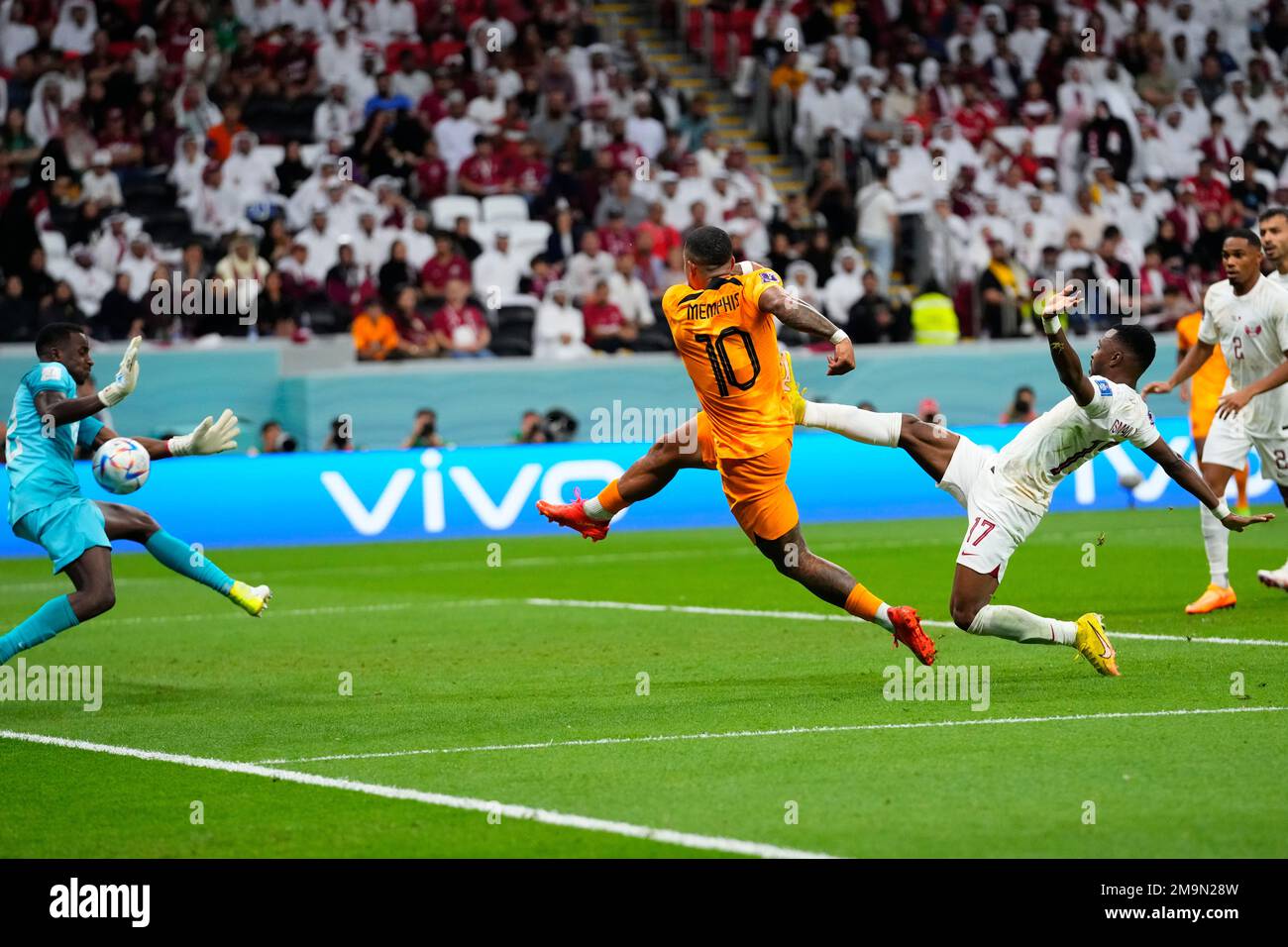 Qatar's goalkeeper Meshaal Barsham blocks a shot from Memphis Depay of the  Netherlands during a World Cup group A soccer match at the Al Bayt Stadium  in Al Khor, Qatar, Tuesday, Nov.
