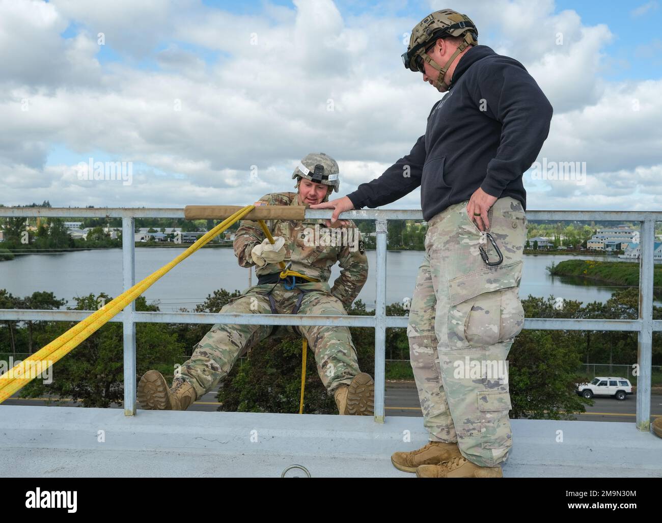 Sgt. 1st Class James Rucks prepares to rappel as rappel master 1st Sgt ...
