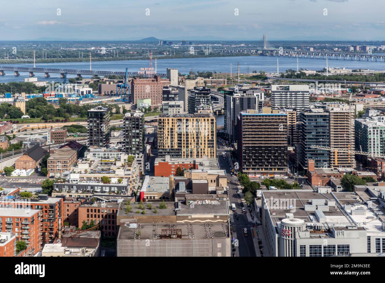 An aerial view of Montreal with Habitat 67 and the Samuel Champlain Bridge in the distance. Quebec, Canada Stock Photo