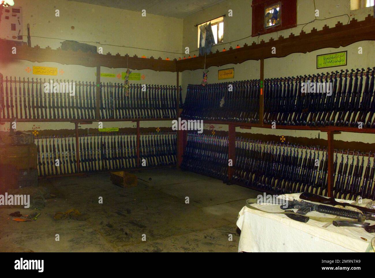 The interior of an Iraqi Armory in Al Kut with racks filled with Tabuk ...