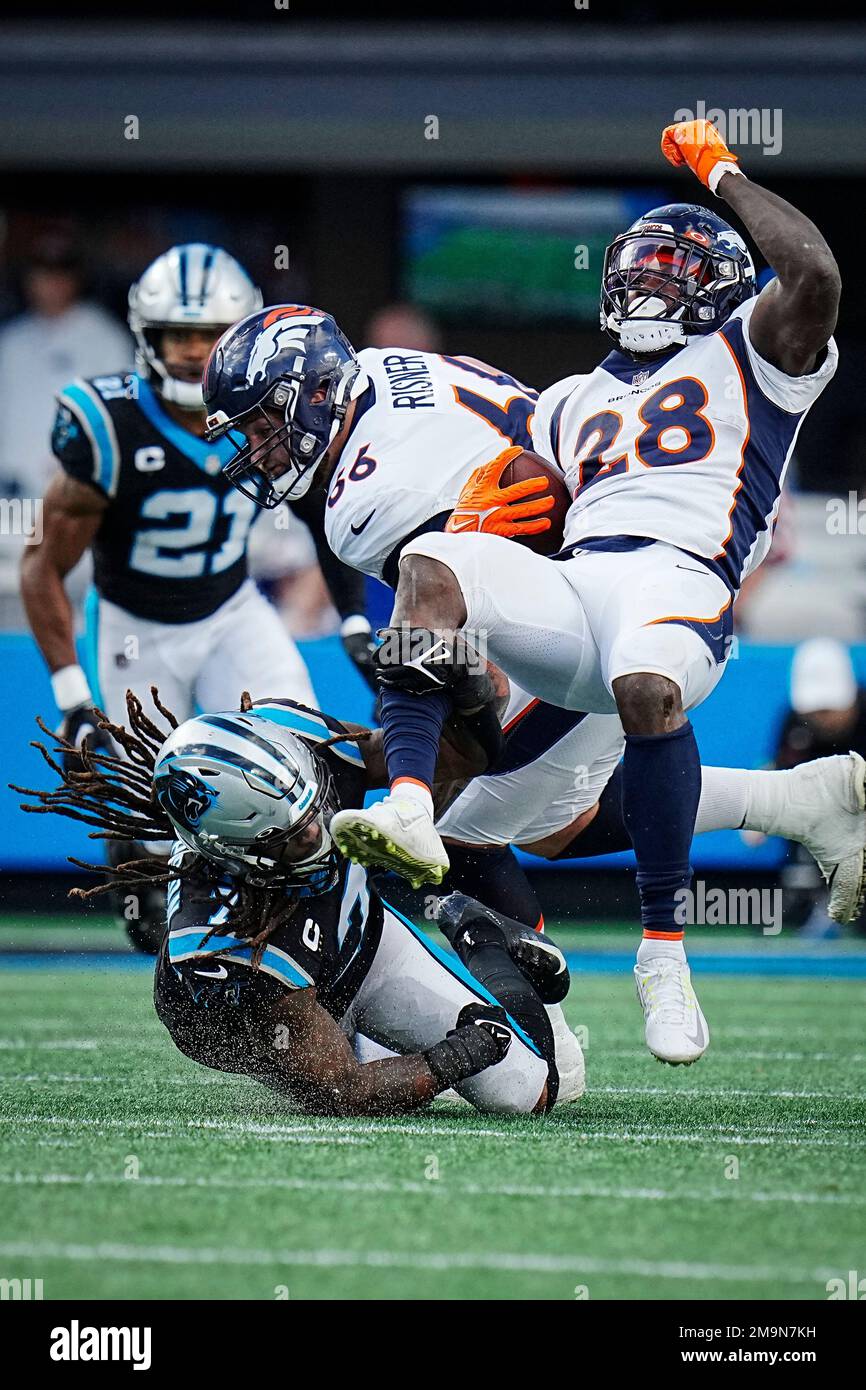 Denver Broncos running back Latavius Murray (28) attempts to avoid the