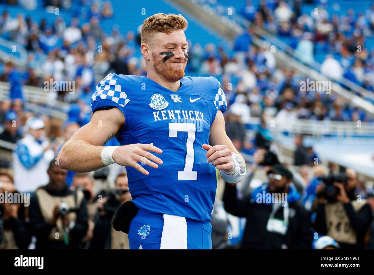 Kentucky quarterback Will Levis runs to greet head coach Mark Stoops during  a senior day celebration before an NCAA college football game against  Louisville in Lexington, Ky., Saturday, Nov. 26, 2022. (AP