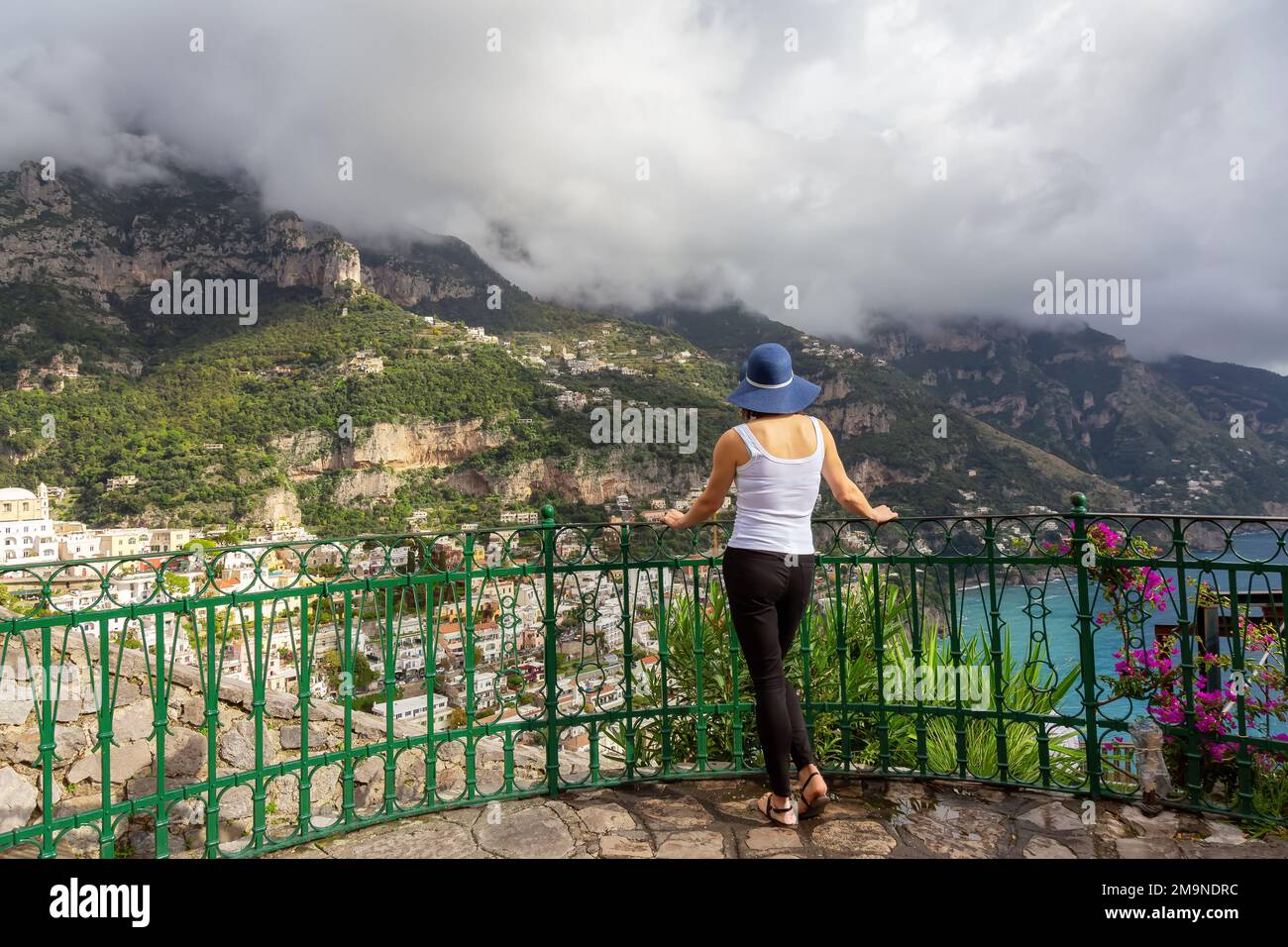 Woman tourist at a touristic town, Positano, by the Tyrrhenian Sea. Amalfi Coast, Italy Stock Photo
