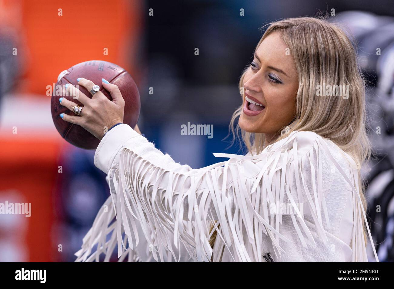 Country music singer Brooke Eden cuts up with a football before the ...