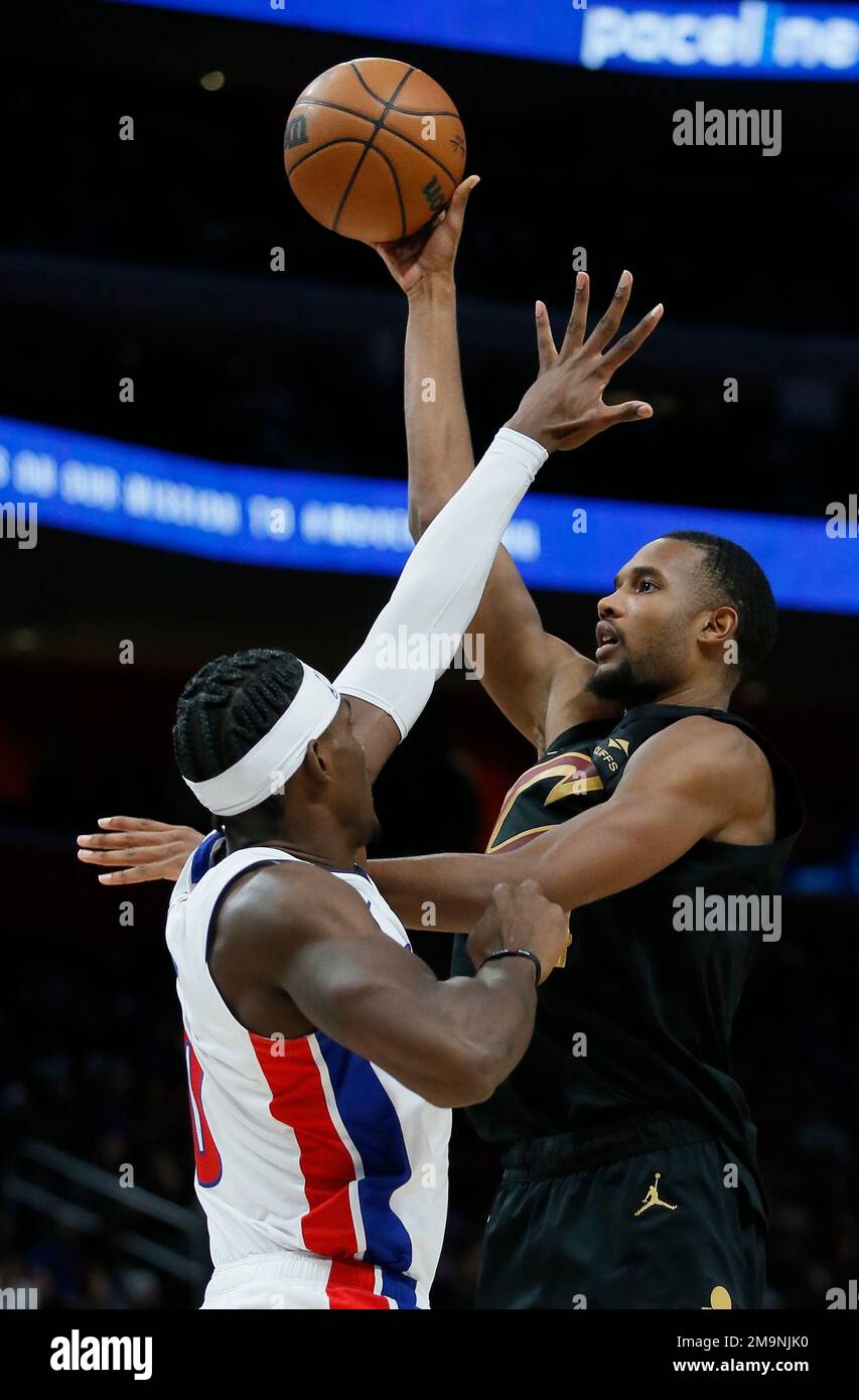 Cleveland Cavaliers forward Evan Mobley, right, shoots against Detroit