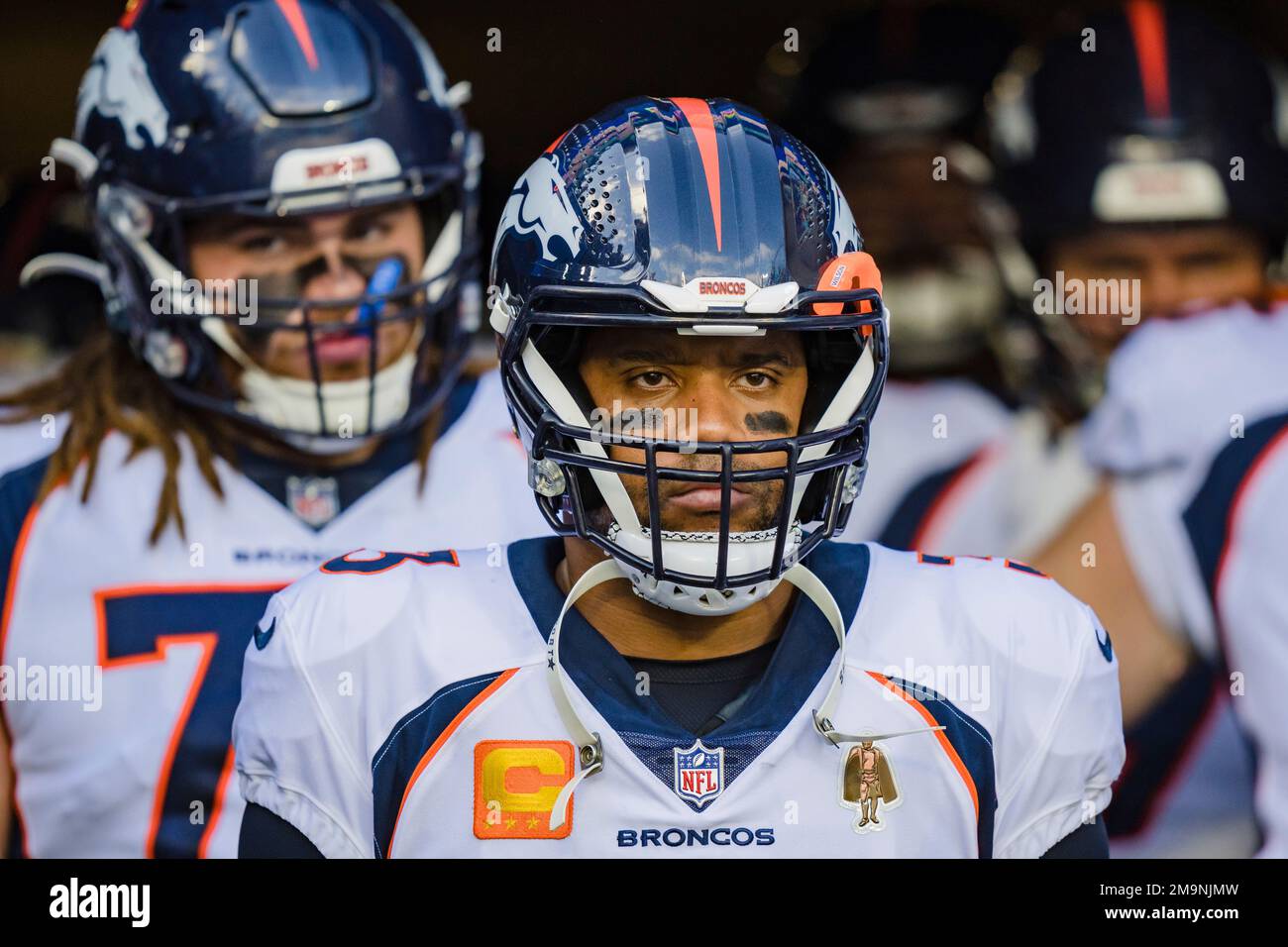 Denver Broncos quarterback Russell Wilson (3) prepares to run onto the  field at the start of an NFL football game between the Carolina Panthers  and the Denver Broncos on Sunday, Nov. 27,