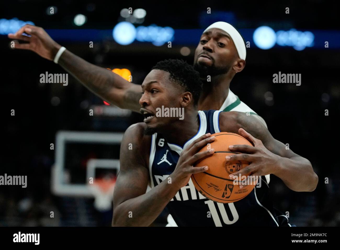 Dallas Mavericks' Dorian FinneySmith drives past Milwaukee Bucks