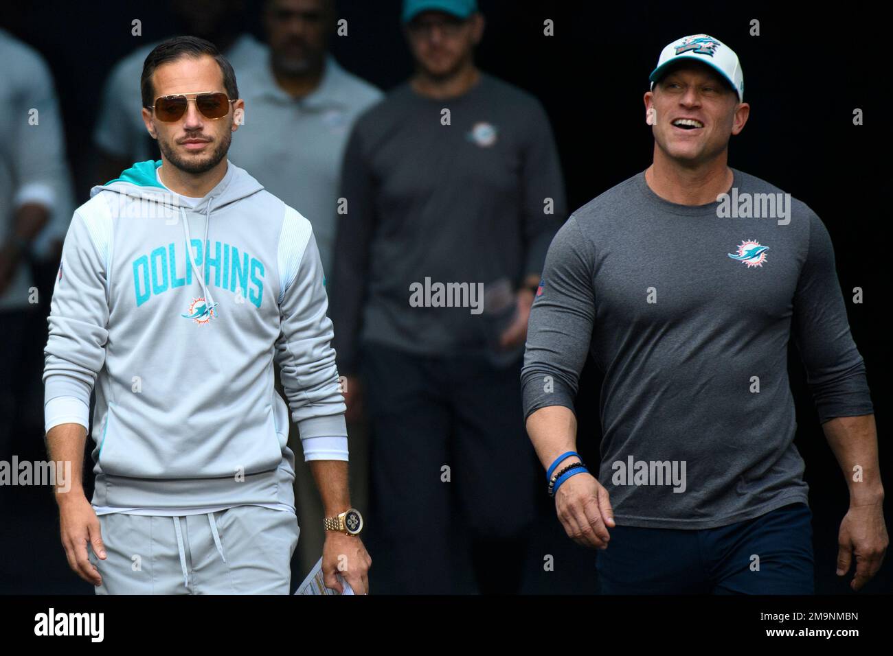 Miami Dolphins head coach Mike McDaniel walks among the players