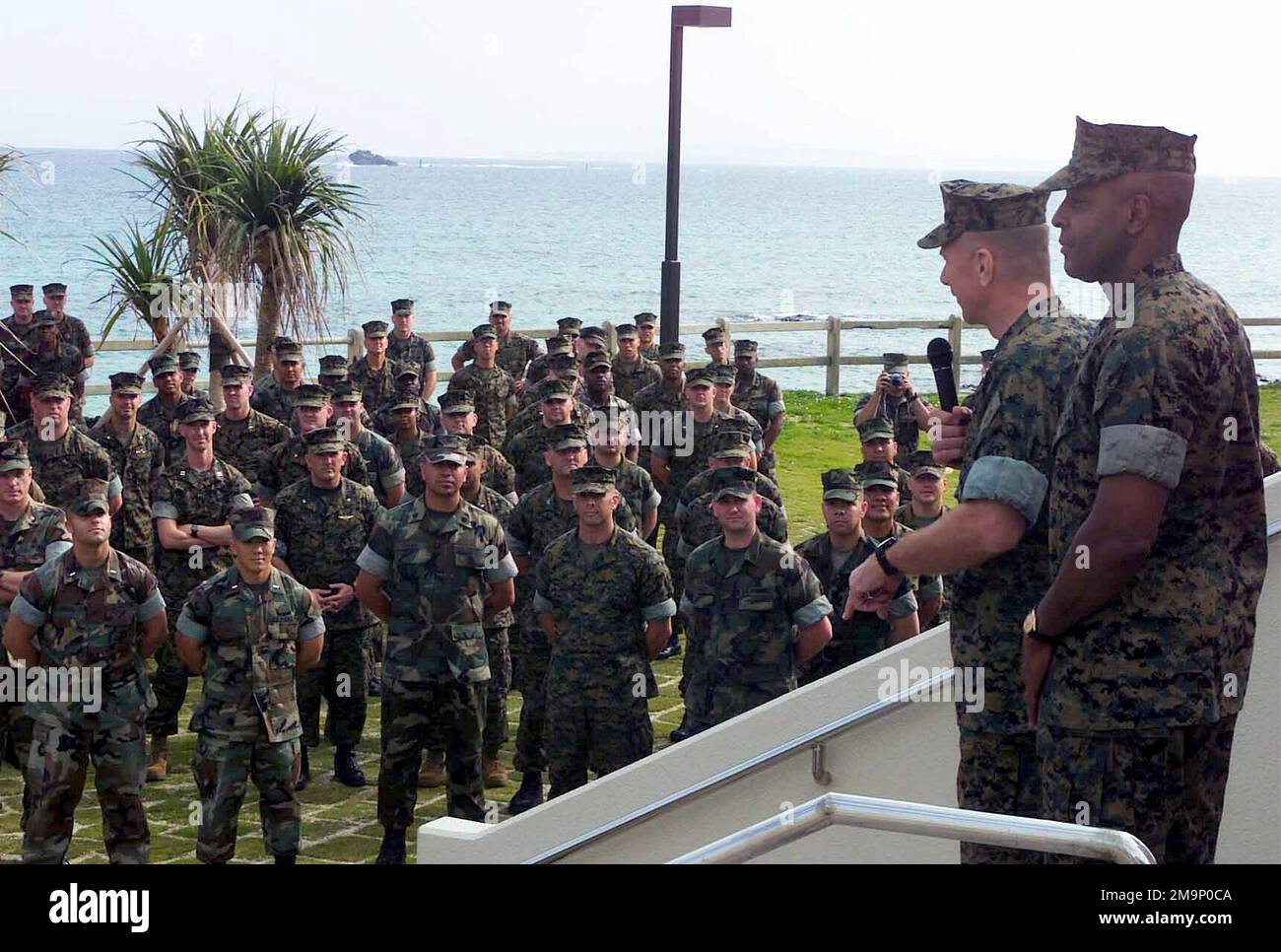 General (GEN) Michael W. Hagee, (w/microphone), Commandant of the Marine Corps (CMC), and Sergeant Major of the Marine Corps Alford McMichael, (right), speak with Marines gathered at the Beachhead, an e-club located on Camp Schwab. GEN Hagee visited III Marine Expeditionary Force (MEF) for the first time as the CMC. During his visit he will tour Marine bases located on Okinawa, Japan. Base: Marine Corps Base, Camp Hansen State: Okinawa Country: Japan (JPN) Scene Major Command Shown: HQMC Stock Photo