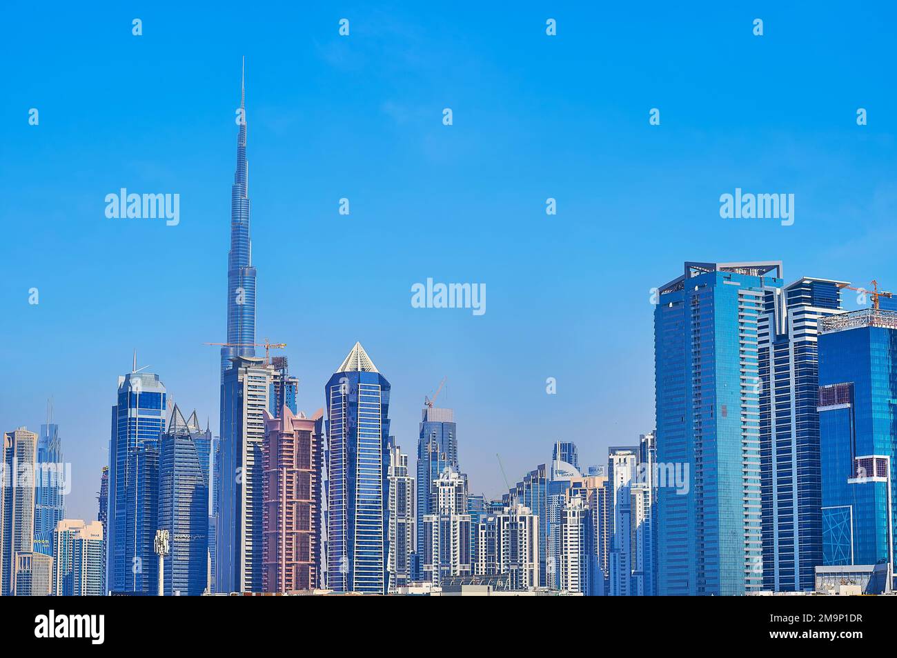 DUBAI, UAE - MARCH 6, 2020: Panorama of the dense Business Bay architecture with Falcon Tower, Escape Tower, Al BathaTower, Single Business Tower and Stock Photo
