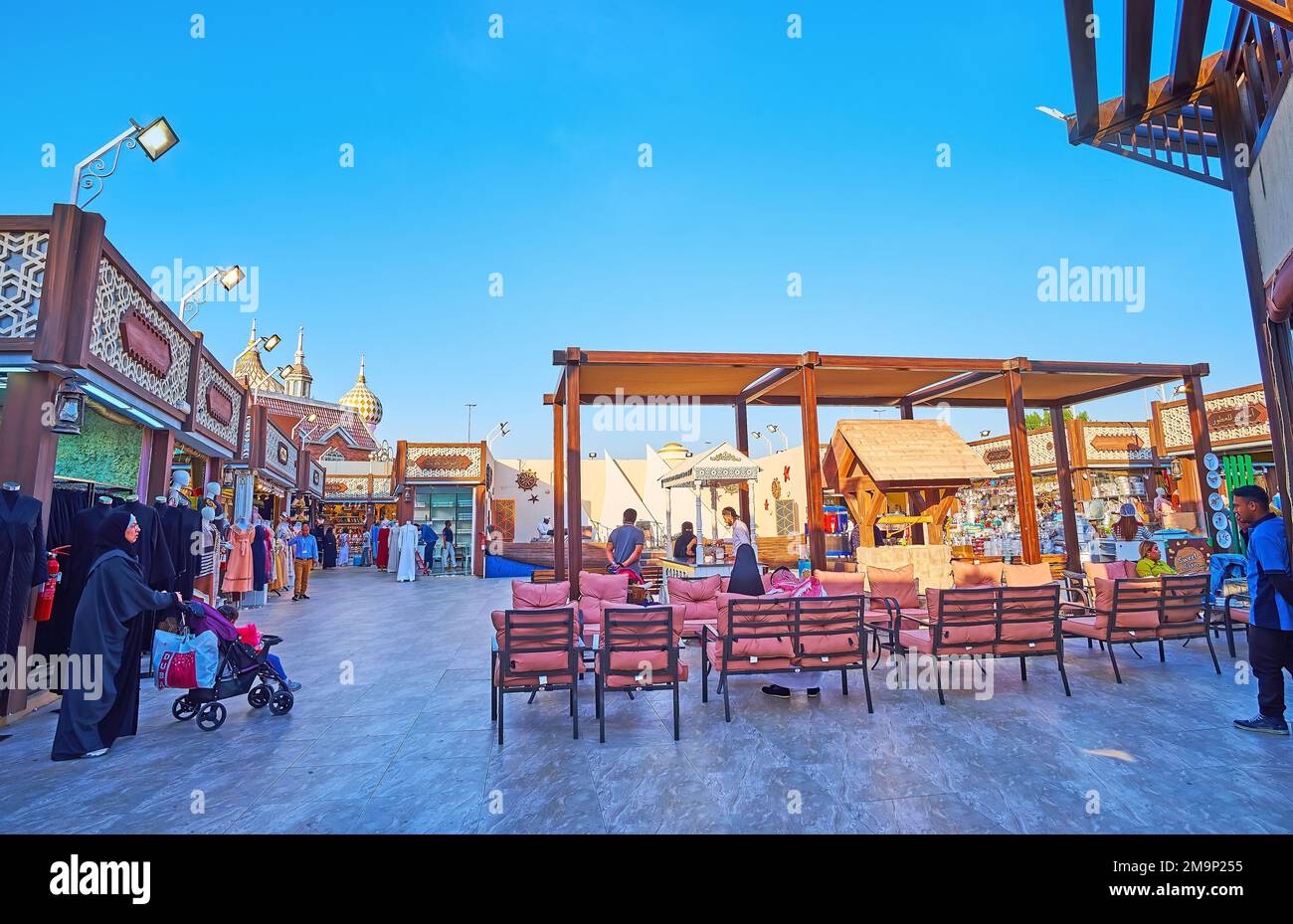 DUBAI, UAE - MARCH 6, 2020: The shops, outdoor cafe and pedestrian area in Kuwait Pavilion of Global Village Dubai, on March 6 in Dubai Stock Photo