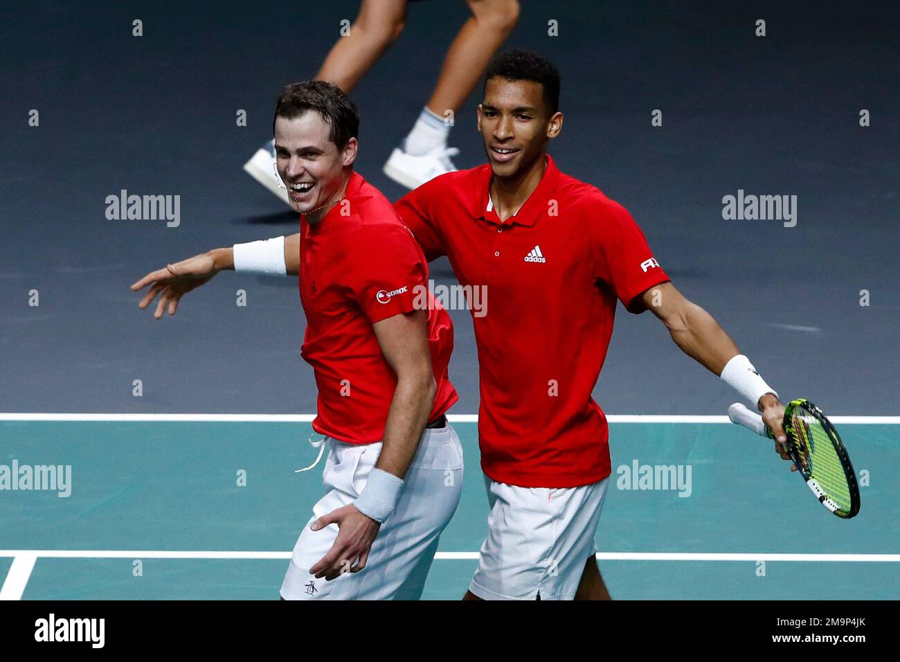 Canada's Vasek Pospisil, left, and Felix Auger Aliassime celebrate after  defeating Italy's Matteo Berrettini and Fabio Fognini during the semi-final  Davis Cup tennis doubles match between Italy and Canada in Malaga, Spain,