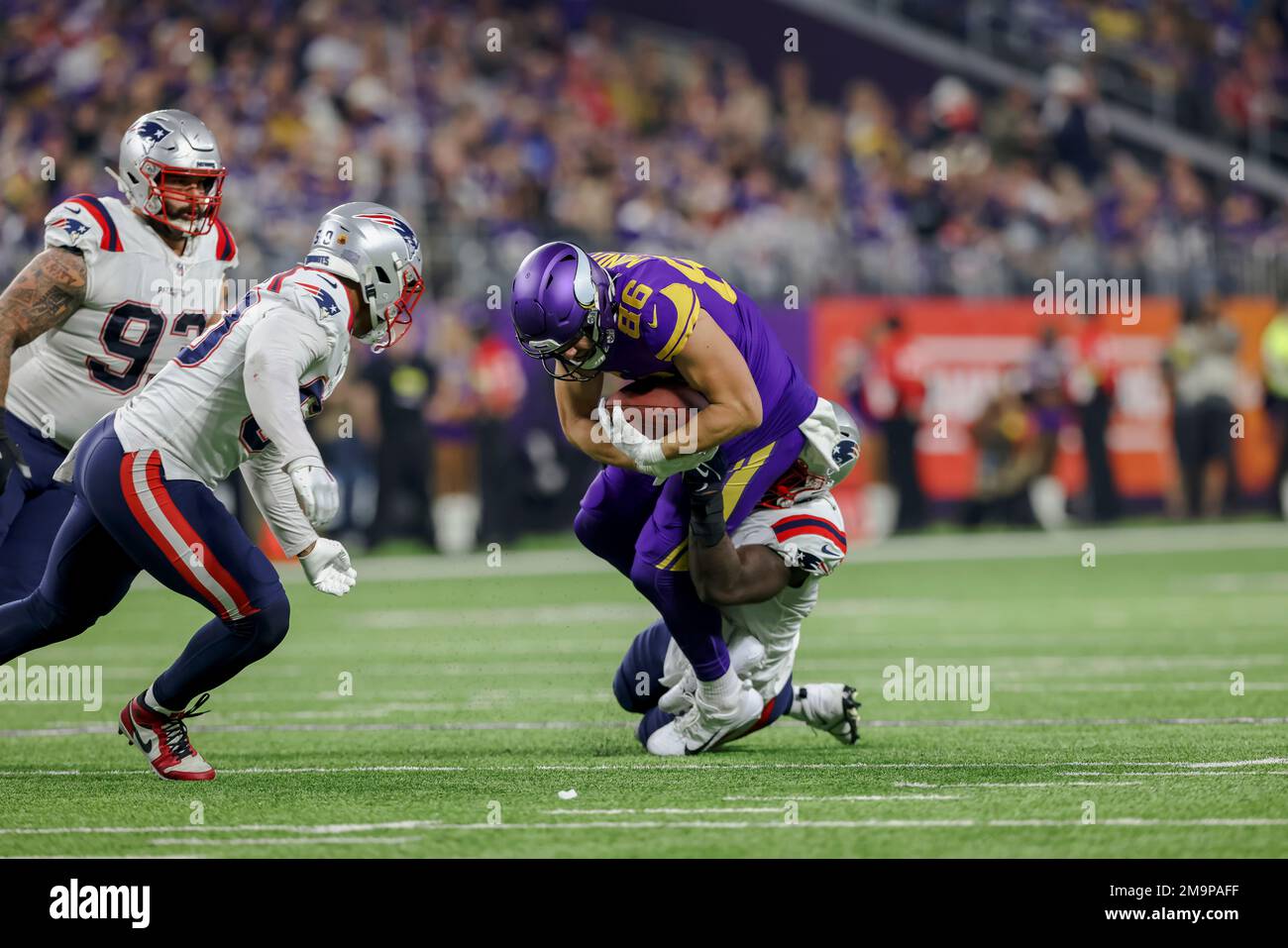 Minnesota Vikings tight end Johnny Mundt (86) in action against New England  Patriots linebacker Ja'Whaun Bentley (8) during the first half of an NFL  football game Thursday, Nov. 24, 2022 in Minneapolis. (