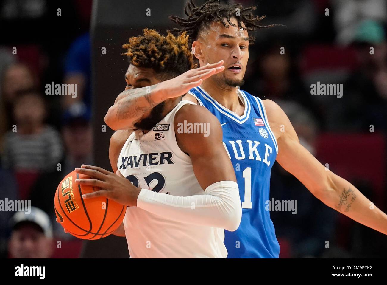 Duke center Dereck Lively II (1) fouls Xavier forward Dieonte Miles (22 ...