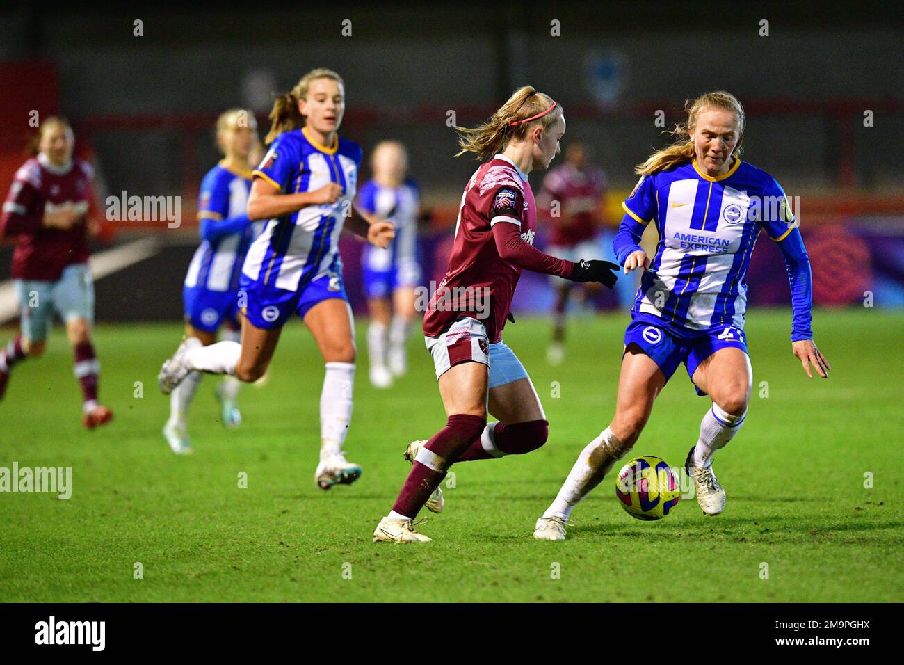 Crawley, UK. 18th Jan, 2023. Izzy Atkinson of West Ham United and Zoe Morse of Brighton and Hove Albion during the FA Women's League Cup Group C match between Brighton & Hove Albion Women and West Ham United Ladies at The People's Pension Stadium on January 18th 2023 in Crawley, United Kingdom. (Photo by Jeff Mood/phcimages.com) Credit: PHC Images/Alamy Live News Stock Photo