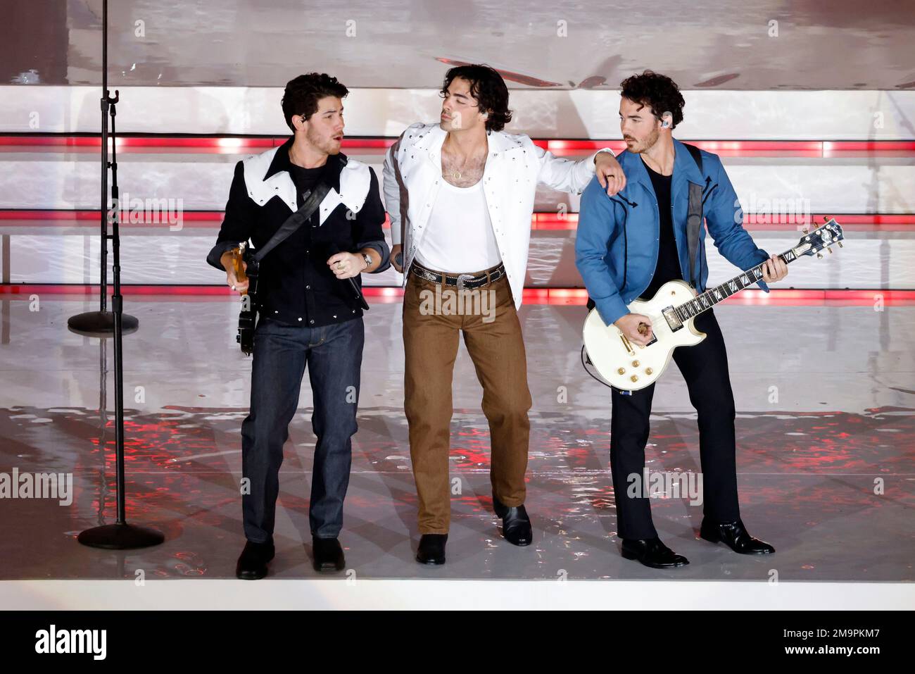 The Jonas Brothers perform during halftime an NFL football game
