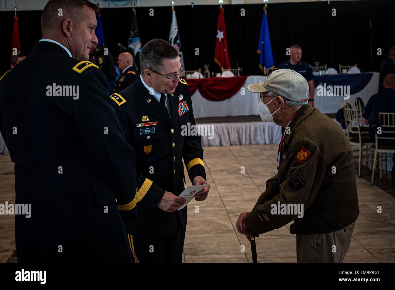Major Gen. Lee Ellis, assistant commanding general for National Guard Affairs, U.S. Materiel Command and Brig. Gen. Ralph Hedenberg, assistant adjutant general for the Connecticut Army National Guard, speak with a World War II veteran at the 73rd annual Connecticut Armed Forces Day Luncheon May 20, 2022. The luncheon is a state tradition that dates back to the 1960s and brings together members of Connecticut’s military, veteran, civic, and business communities to celebrate military service and to honor those who have served, or continue to serve, the state and nation. Stock Photo