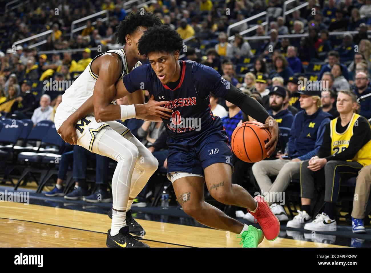 Jackson State guard Gabe Watson, right, drives to the basket past