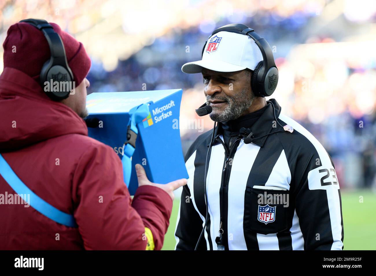 NFL referee Jerome Boger (23) watches a replay during the second half of an  NFL football game between the Minnesota Vikings and the Washington  Commanders, Sunday, Nov. 6, 2022, in Landover, Md. (