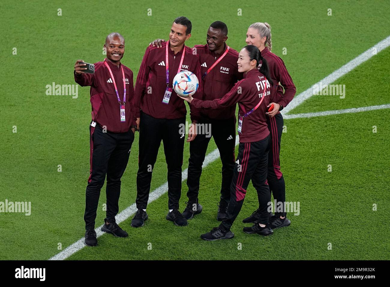 Japanese referee Yoshimi Yamashita, right, poses for a picture on the