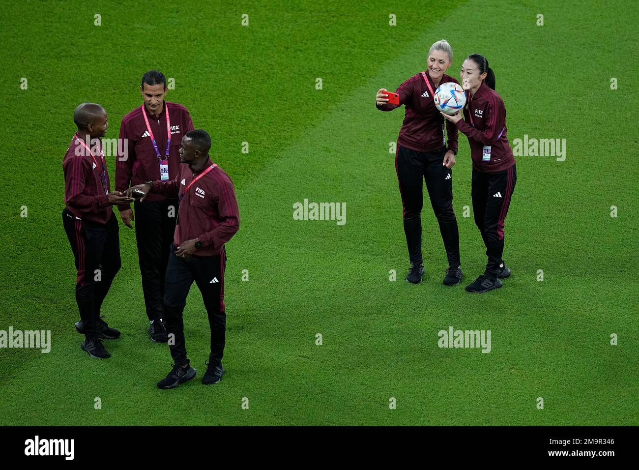Japanese referee Yoshimi Yamashita, right, poses for a picture on the