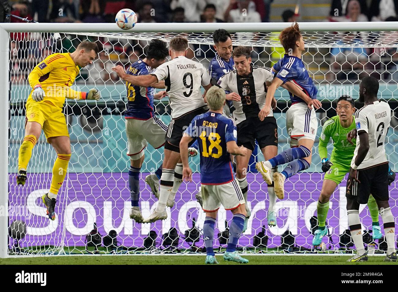 Germany's goalkeeper Manuel Neuer, left, goes for a header during the ...