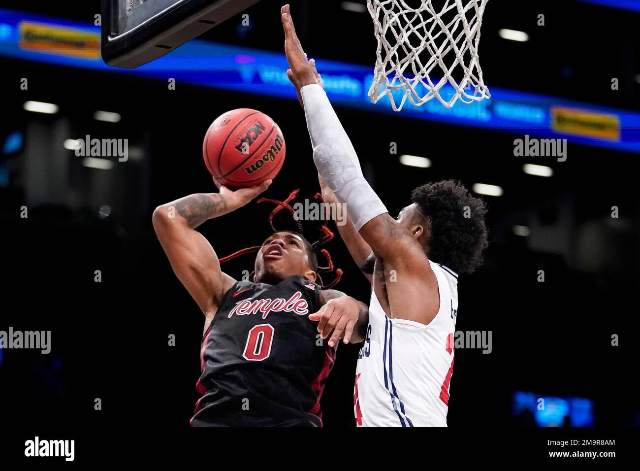 Temple's Khalif Battle (0) shoots against Richmond's Isaiah Bigelow (24