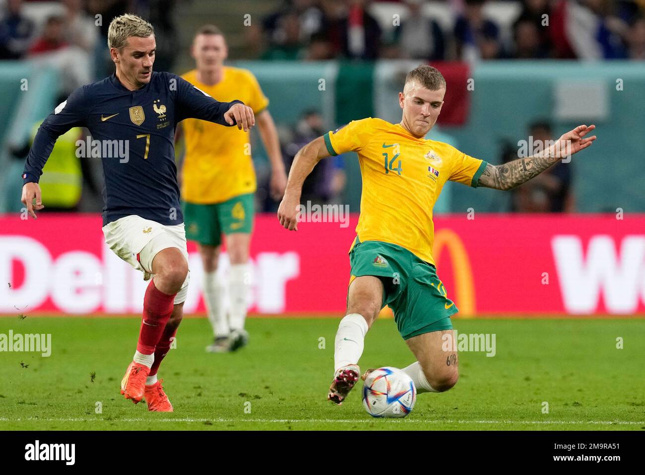 France's Antoine Griezmann vies for the ball with Australia's Riley ...