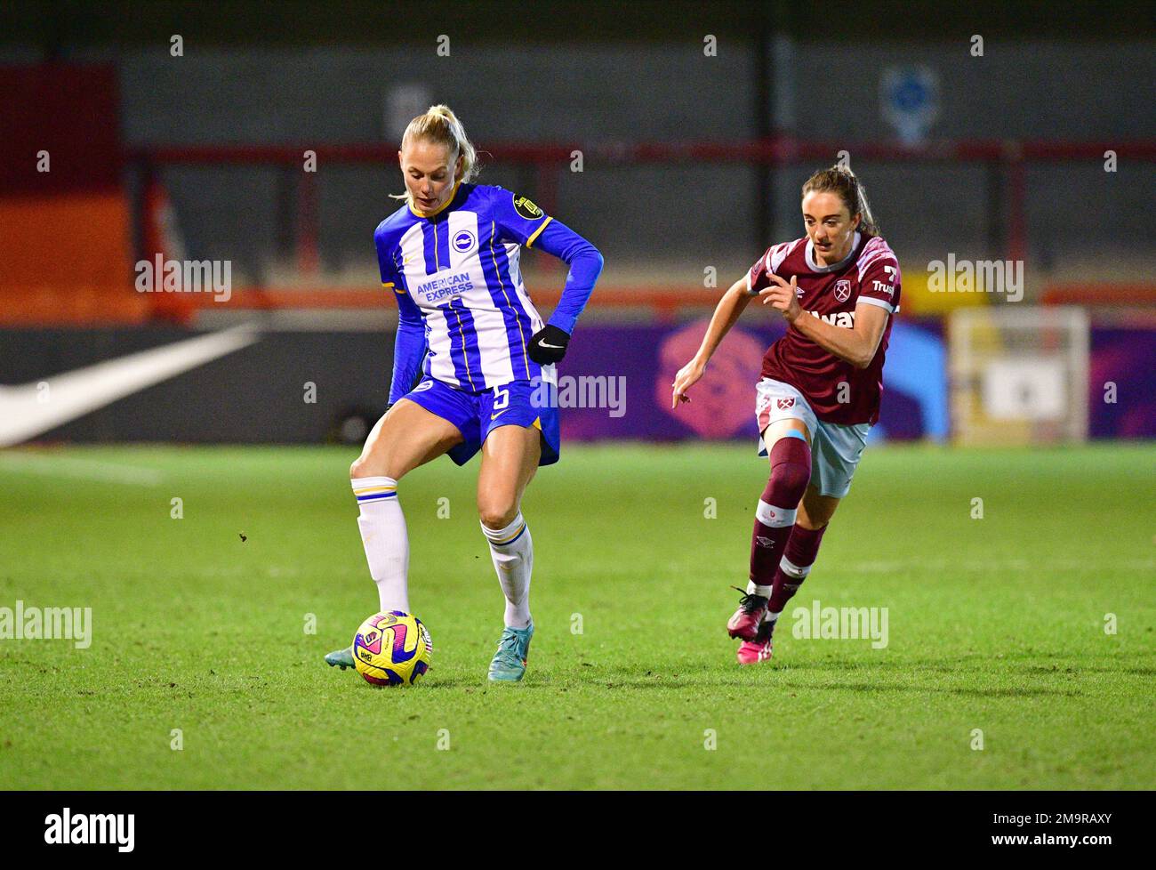 Crawley, UK. 18th Jan, 2023. Guro Bergsvand of Brighton and Hove Albion and Lisa Evans of West Ham United of West Ham United during the FA Women's League Cup Group C match between Brighton & Hove Albion Women and West Ham United Ladies at The People's Pension Stadium on January 18th 2023 in Crawley, United Kingdom. (Photo by Jeff Mood/phcimages.com) Credit: PHC Images/Alamy Live News Stock Photo