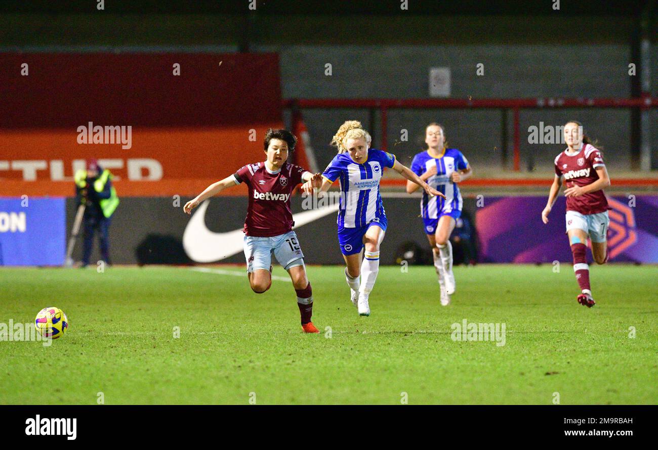 Crawley, UK. 18th Jan, 2023. Honoka Hayashi of West Ham United holds off Katie Robinson of Brighton and Hove Albion during the FA Women's League Cup Group C match between Brighton & Hove Albion Women and West Ham United Ladies at The People's Pension Stadium on January 18th 2023 in Crawley, United Kingdom. (Photo by Jeff Mood/phcimages.com) Credit: PHC Images/Alamy Live News Stock Photo