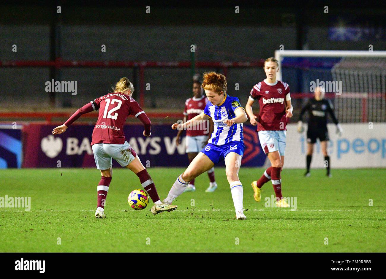 Crawley, UK. 18th Jan, 2023. Kate Longhurst of West Ham United and Libby Bance of Brighton and Hove Albion during the FA Women's League Cup Group C match between Brighton & Hove Albion Women and West Ham United Ladies at The People's Pension Stadium on January 18th 2023 in Crawley, United Kingdom. (Photo by Jeff Mood/phcimages.com) Credit: PHC Images/Alamy Live News Stock Photo