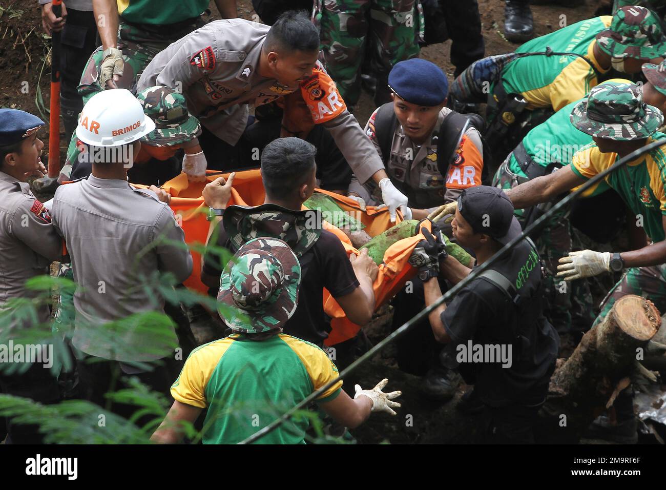 Rescuers recover the body of a victim of an earthquaketriggered