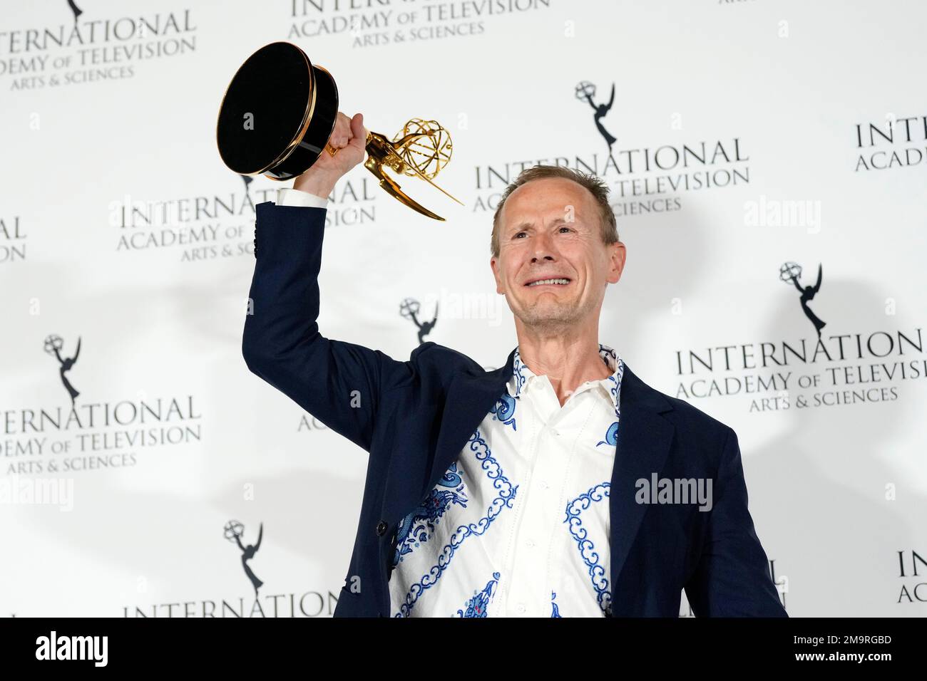 Marc Munden appears in the press room at the 50th International Emmy
